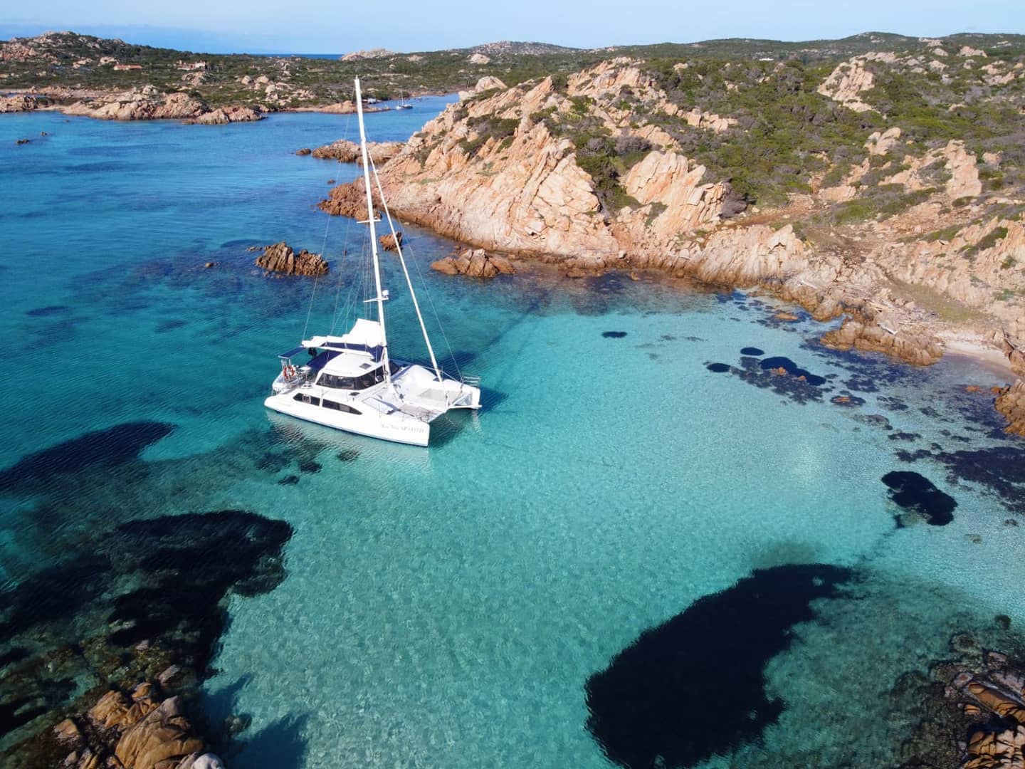 UBI RENT - Rental cars, scooters, bicycles and excursions by boat, catamaran, trekking and more - Olbia - Sardinia - Catamaran on the coast